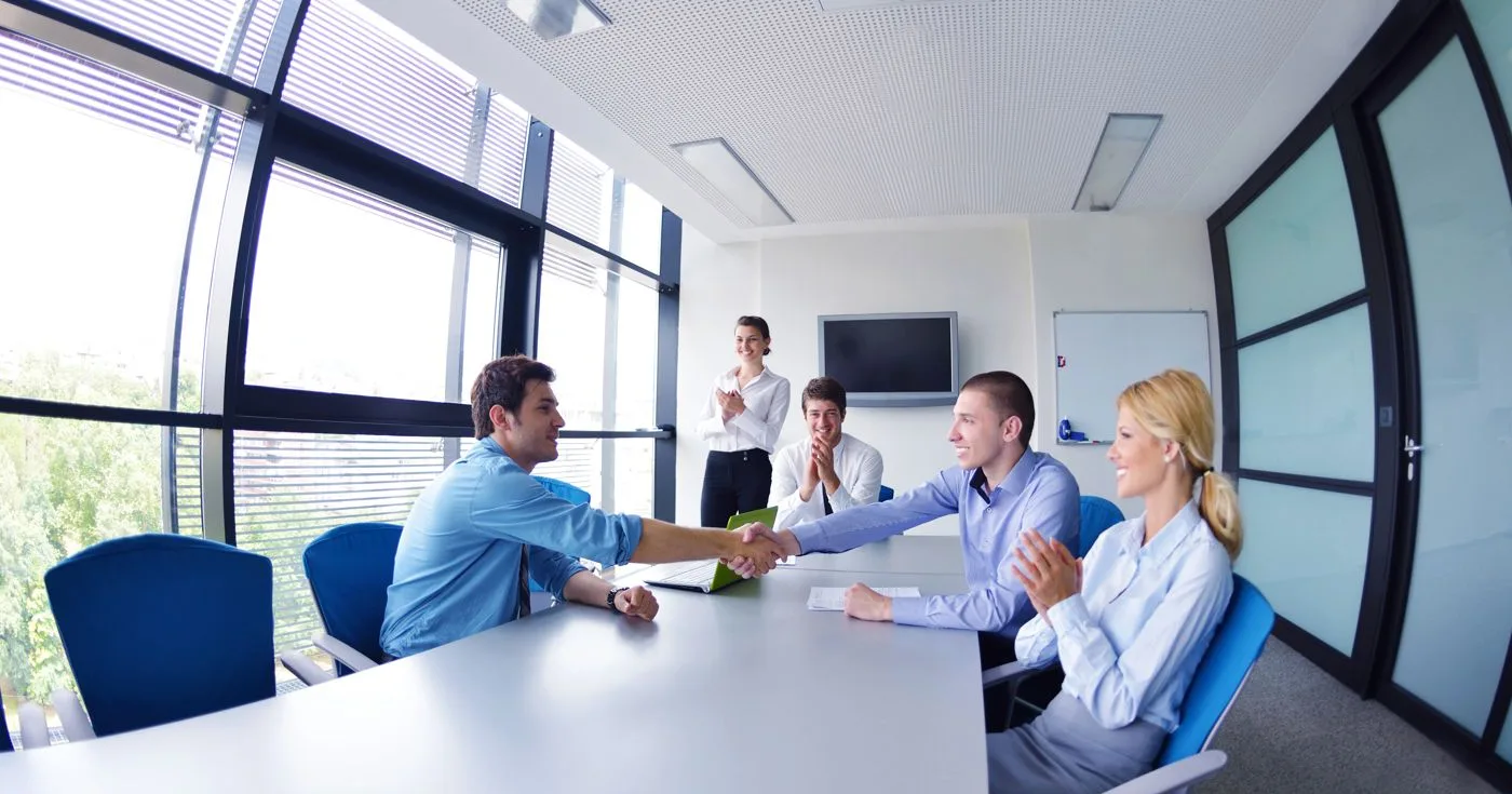 Sales team meeting with a customer around a conference table