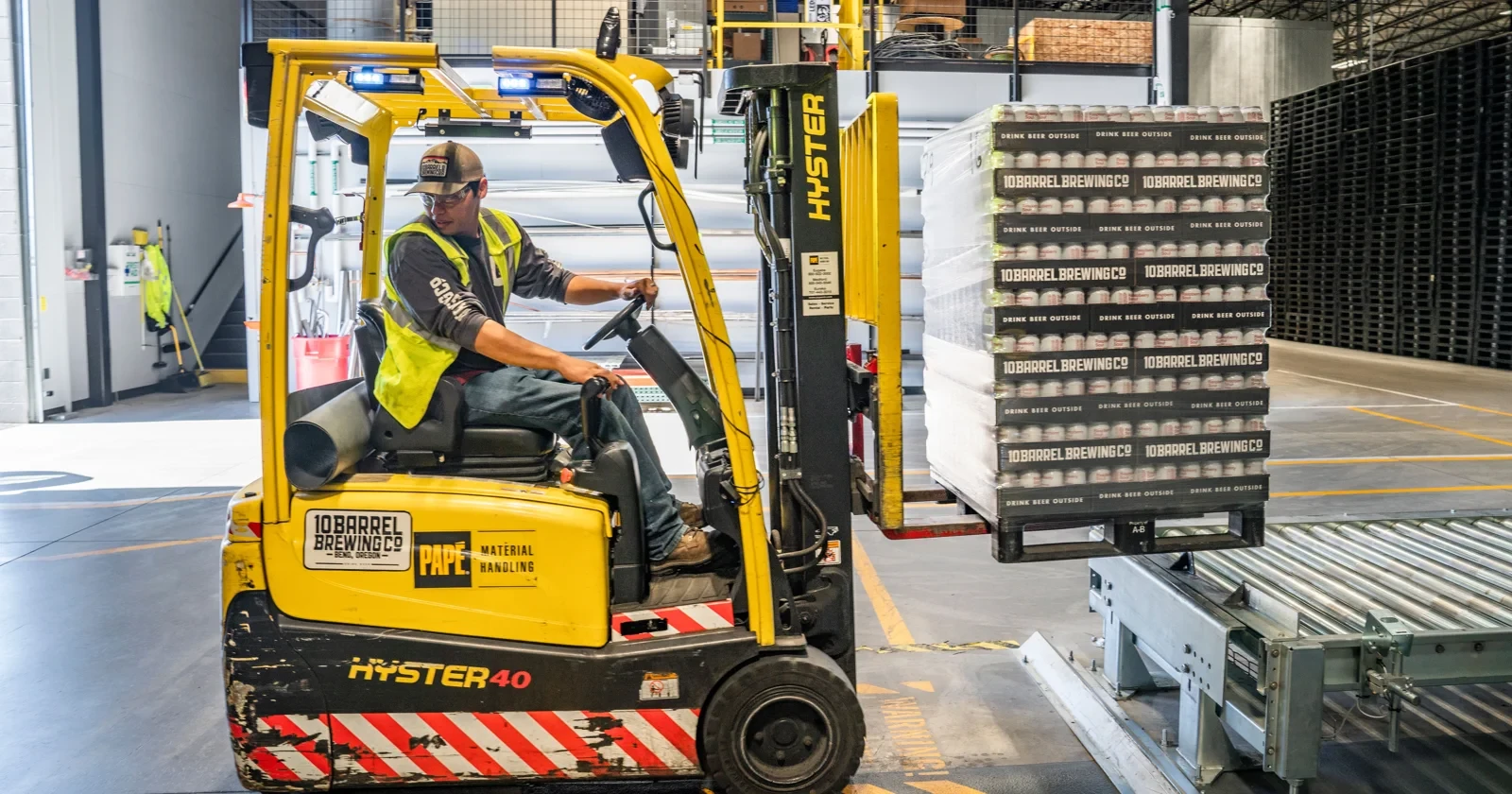 Forklift at work in a warehouse, photographed by ELEVATE