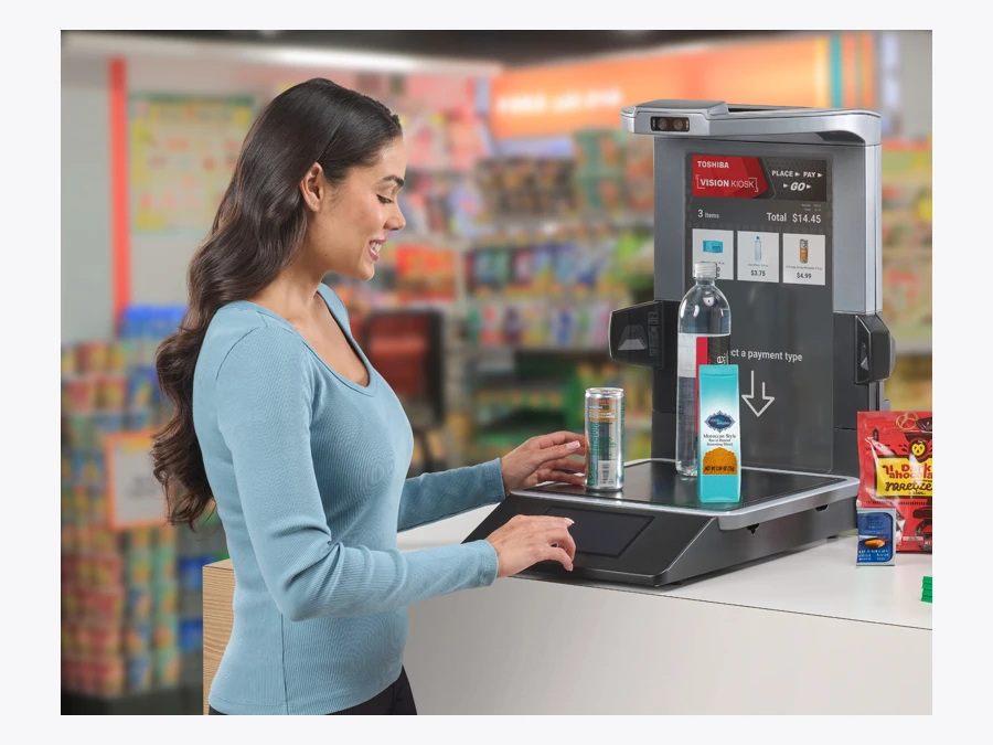 Toshiba manufacturer promotional photograph of MxP Vision Kiosk use