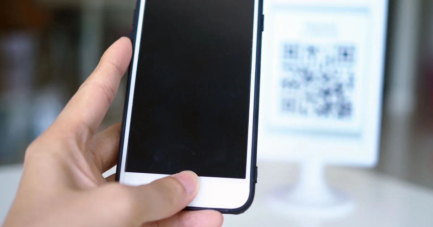 Phone scanning a shelf code to check product information